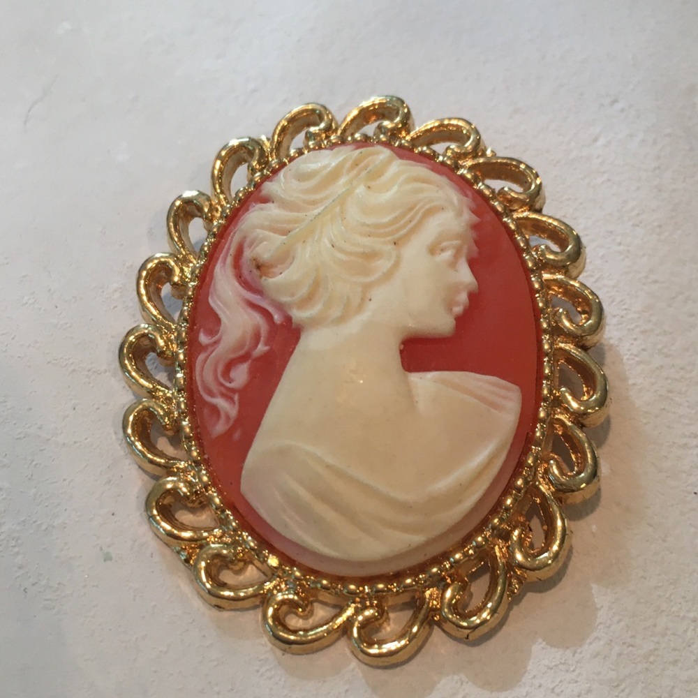 Vintage brooch. Orange white and gold.
